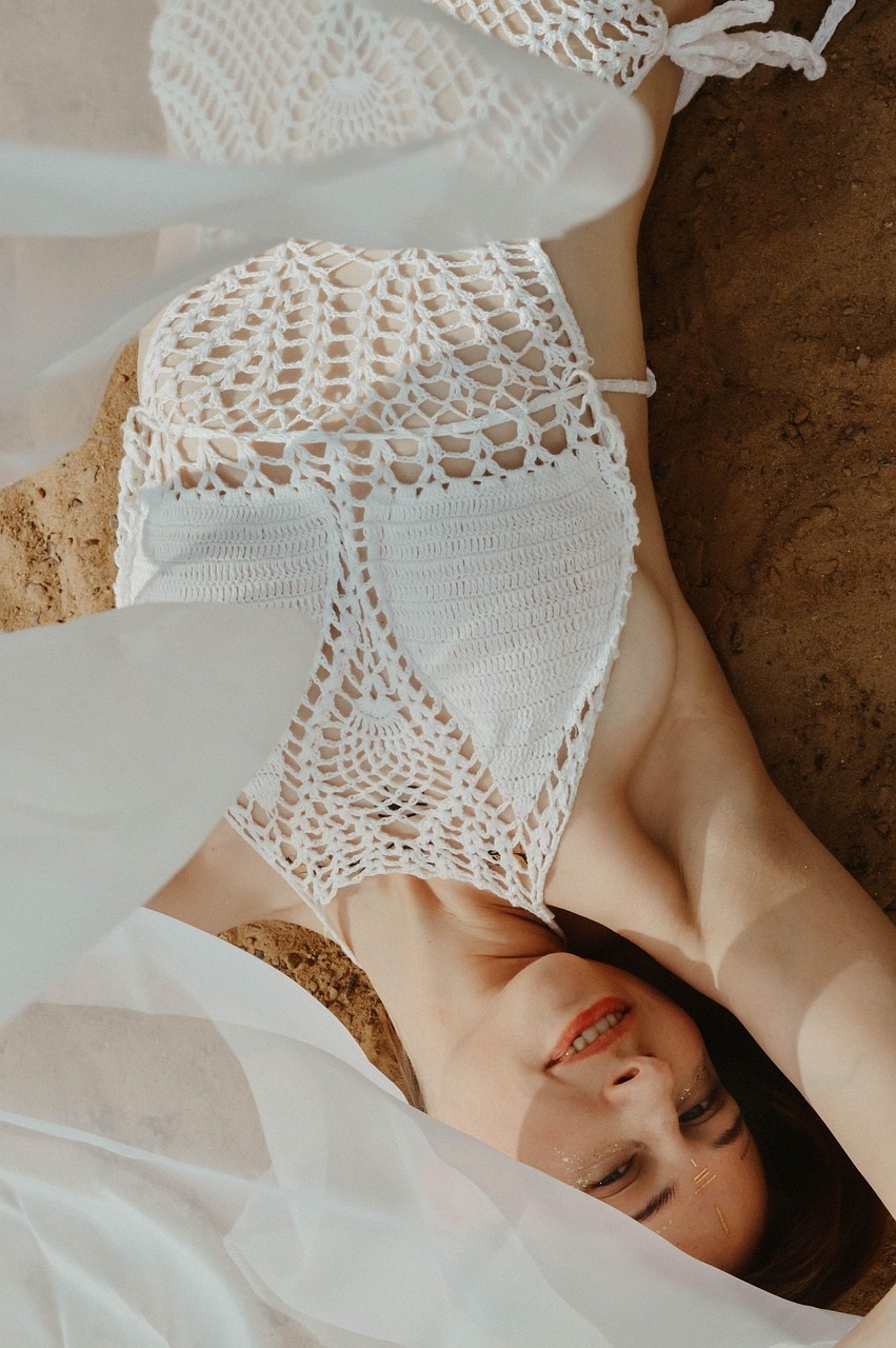 swimsuit, beach, vacation, relaxation, woman, bikini, sea, ocean, nature, sand, knitted swimsuit, white swimsuit, style, fashion, a tan, the sun, sunbathing photos, relax on the beach, tan leather, a swarthy complexion, a nice tan, solarium, sunscreen, tan in the sun, girl tan sea, sun, koreanskt solskydd bäst i test